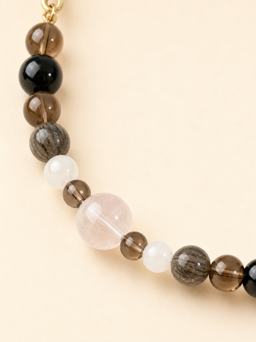 Close-up of black obsidian crystal beads on PrismTail natural stone pet collar