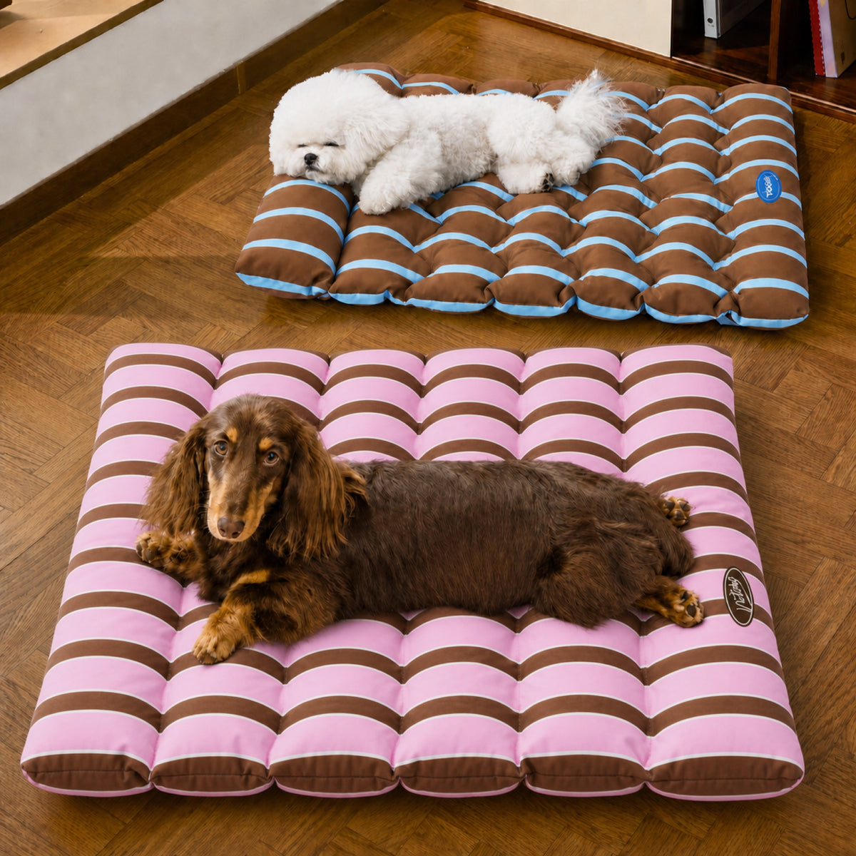 Two dogs resting on PrismTail Meadow Mat reversible bolster pet mats in pink-brown and blue-brown stripes