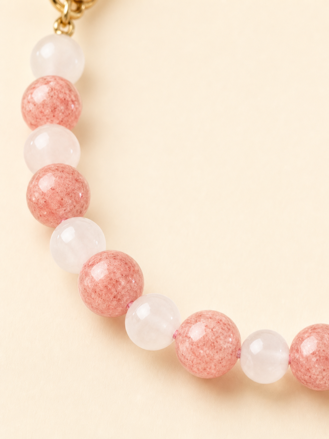 Close-up of rose quartz crystal beads on PrismTail natural stone pet collar