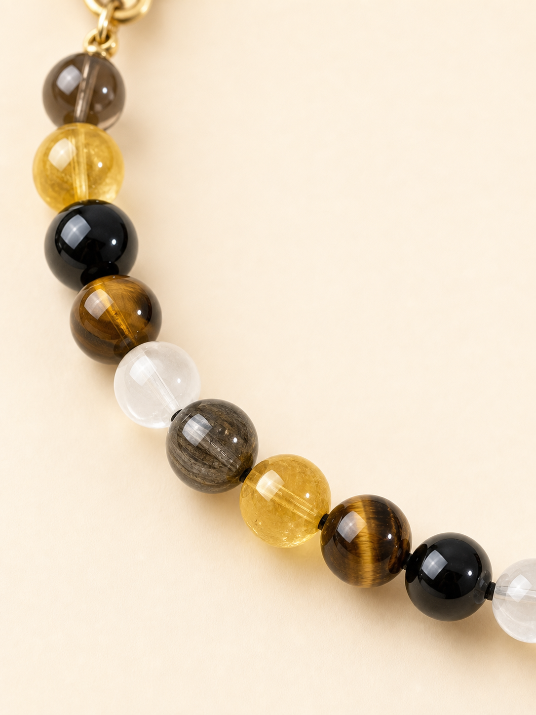 Close-up of tiger's eye crystal beads on PrismTail natural stone pet collar